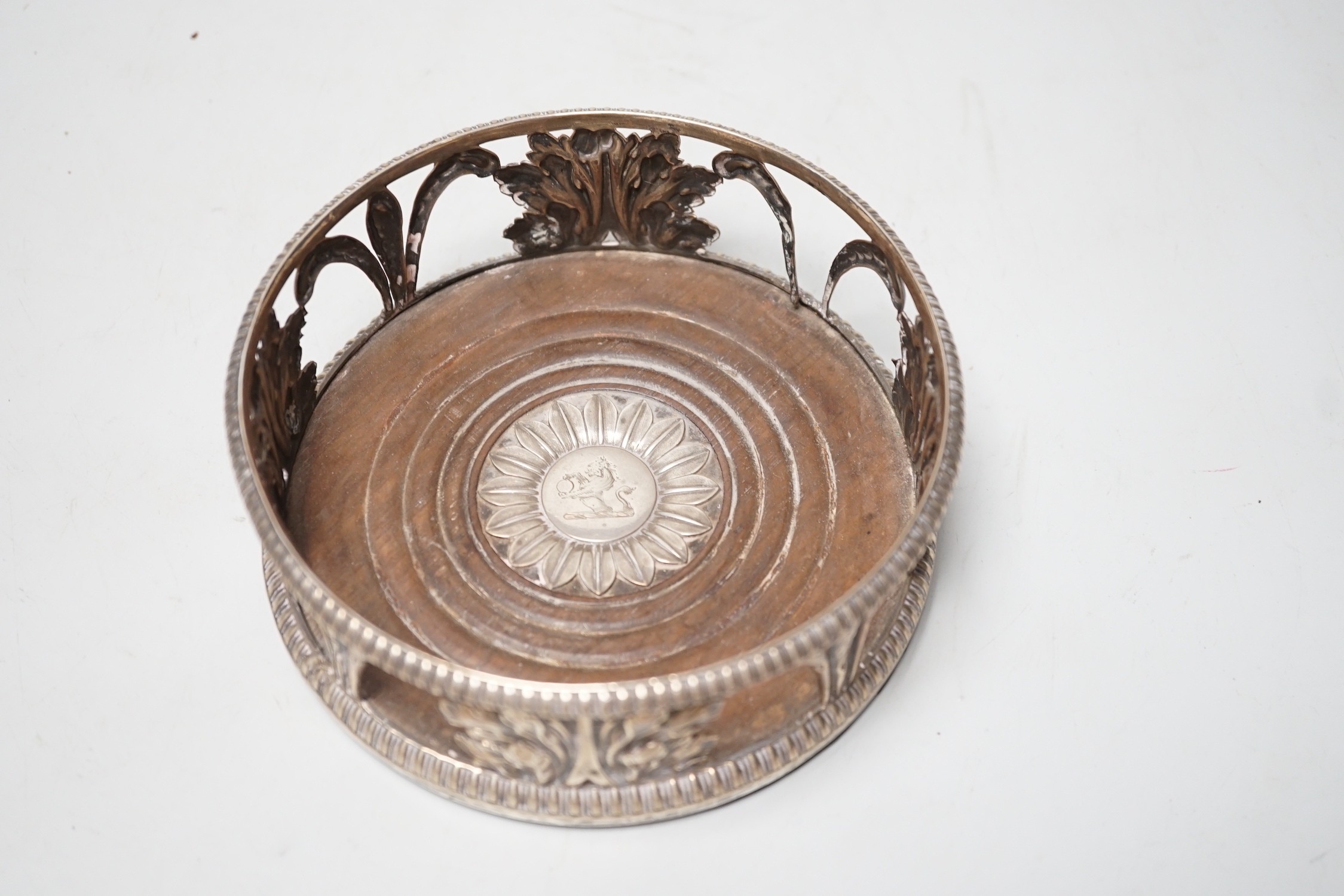 An early 19th century silver mounted wine coaster, marks rubbed, 14cn.
